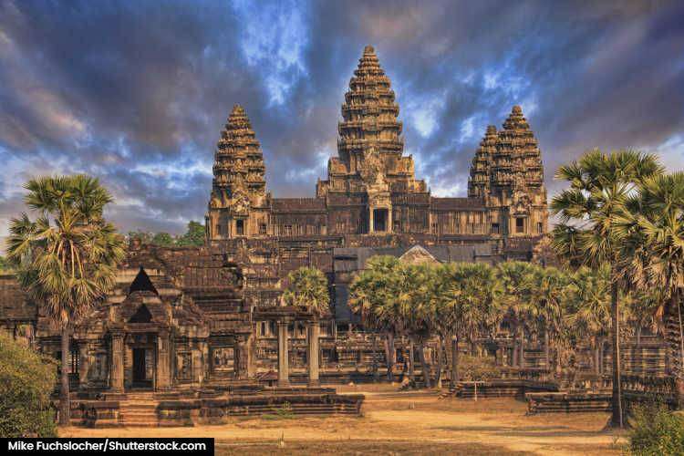 The main temple of Angkor Wat under dark skies