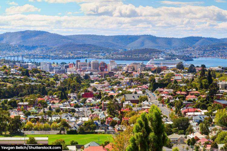 Aerial view of Hobart with a cruise ship in the background
