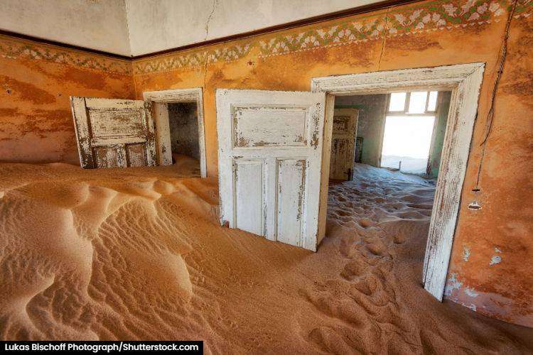 A house taken over by sand outside of Luderitz